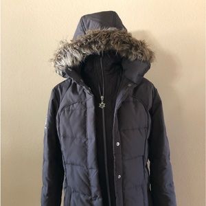 Ski and Snow jacket.  Removable hood.  Brown with tan trim.  Size Small.